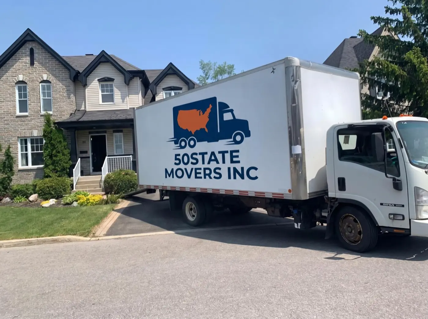 50STATEMOVERS truck parked outside a house